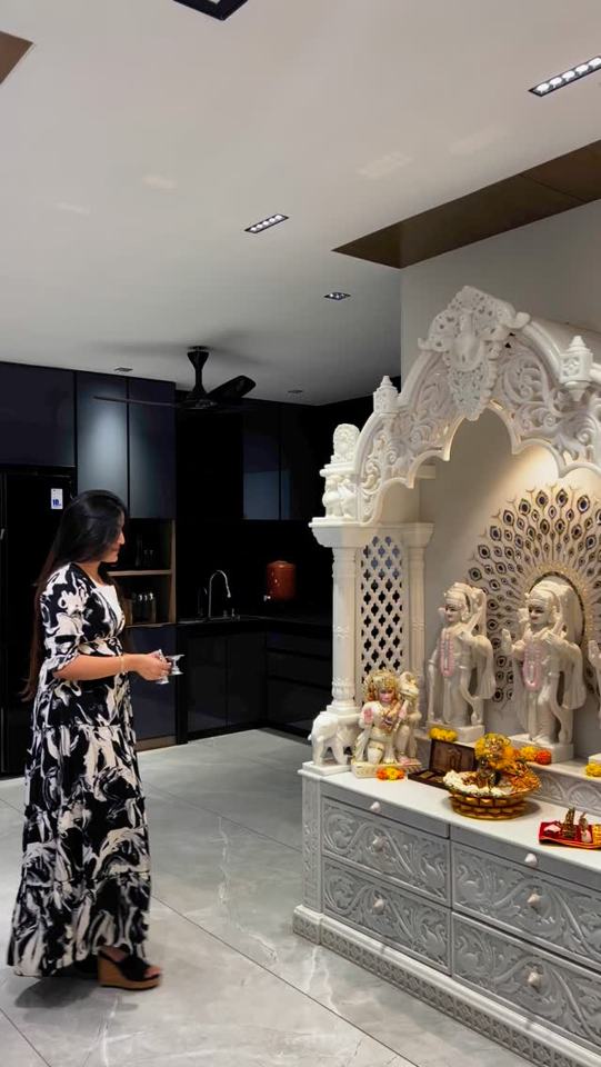 A divine blend of elegance and spirituality, this marble mandir glows…